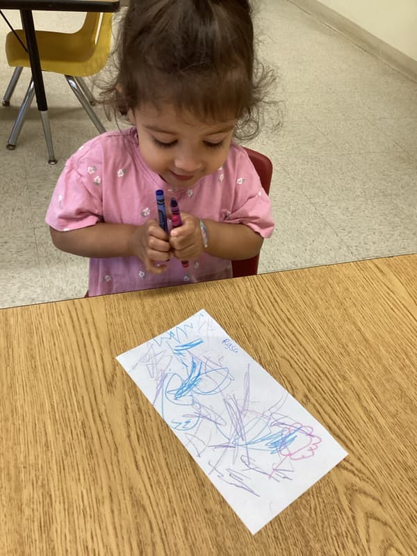 Early Preschool practices using art materials to make lines.