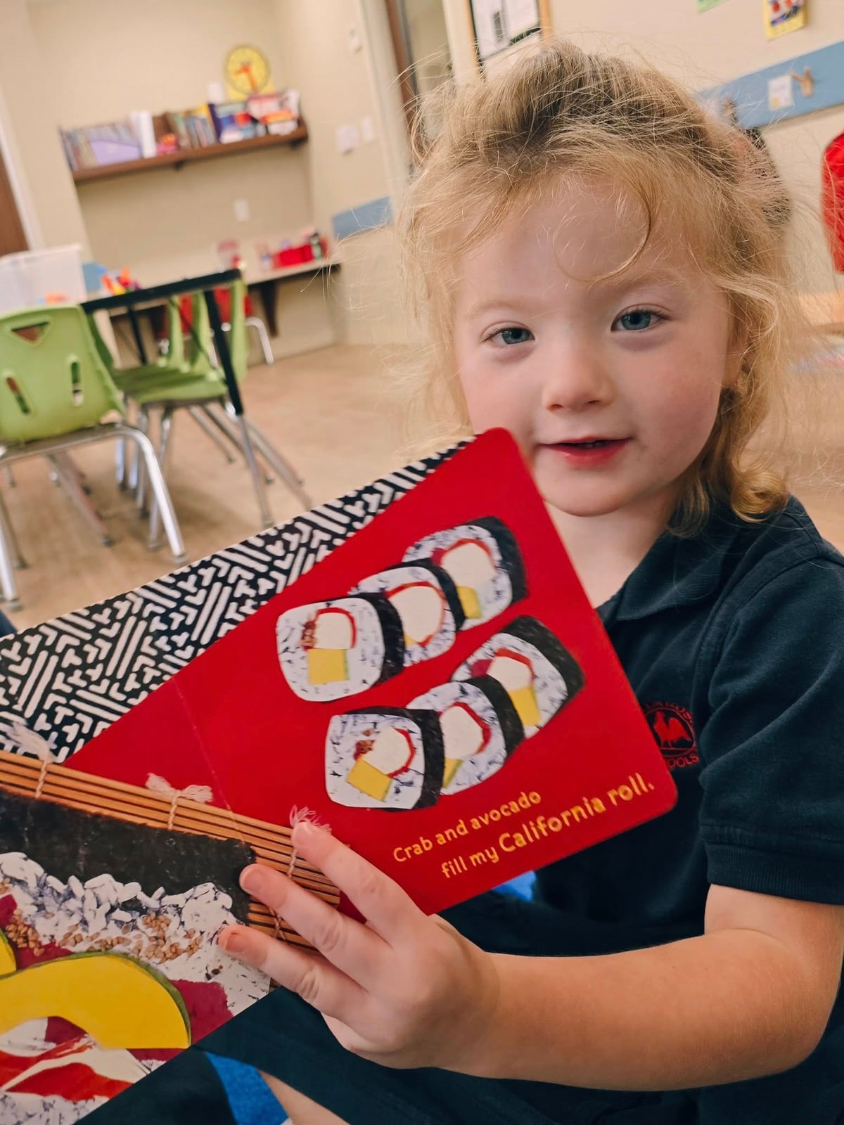 Pre-Kindergarten students exploring books about food from different cultures at a preschool in Keller, Texas 76244.