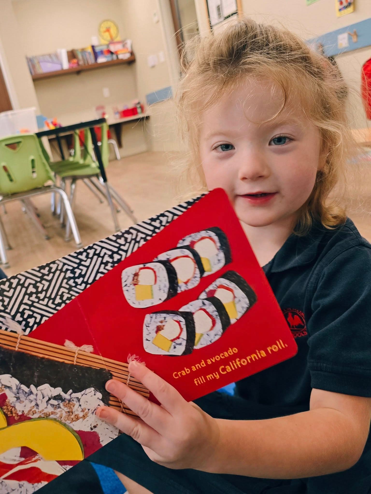 Pre-Kindergarten students exploring books about food from different cultures at a preschool in Keller, Texas 76244.