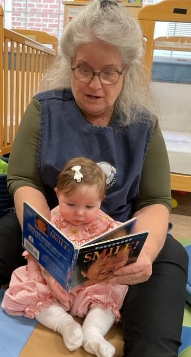 teacher ready to an infant