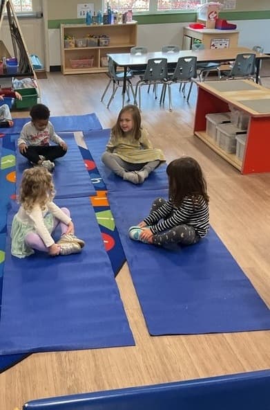 4 children doing yoga