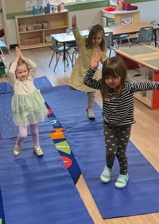 4 children doing yoga