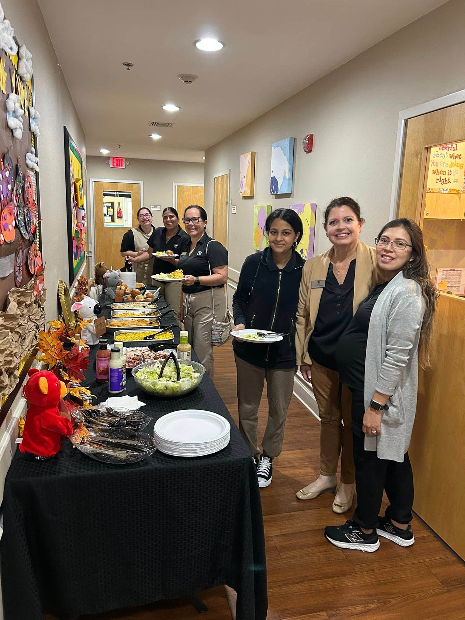 tables with food set up and teachers getting food