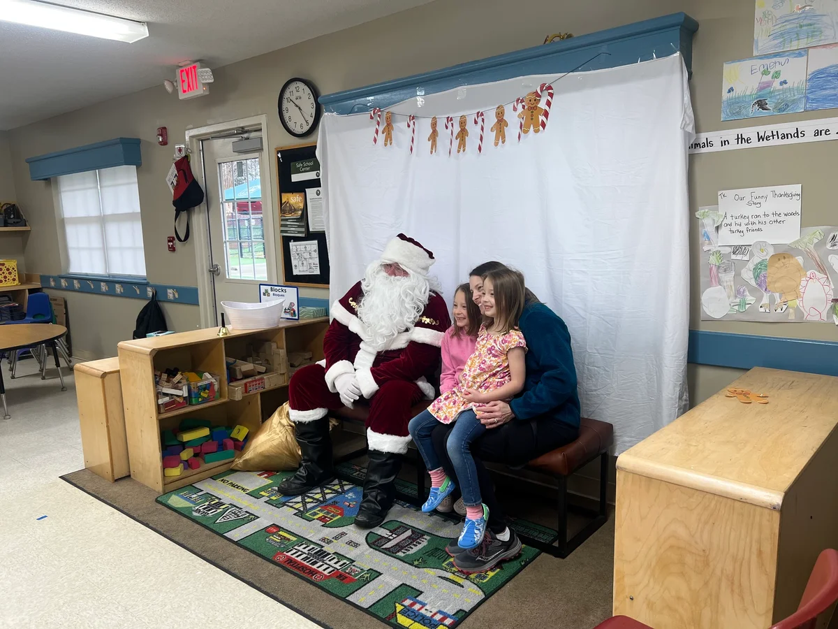 Families enjoying Winterfest 2025 at Primrose School at West Lake with cookies, crafts, hot chocolate, and a visit from Santa.