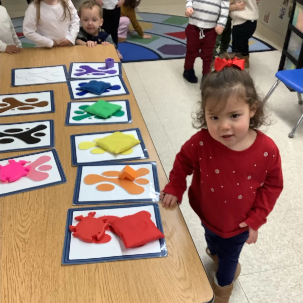 Wonder Program children at Primrose School at West Lake exploring colors through sorting, painting, mixing, and creative activities.