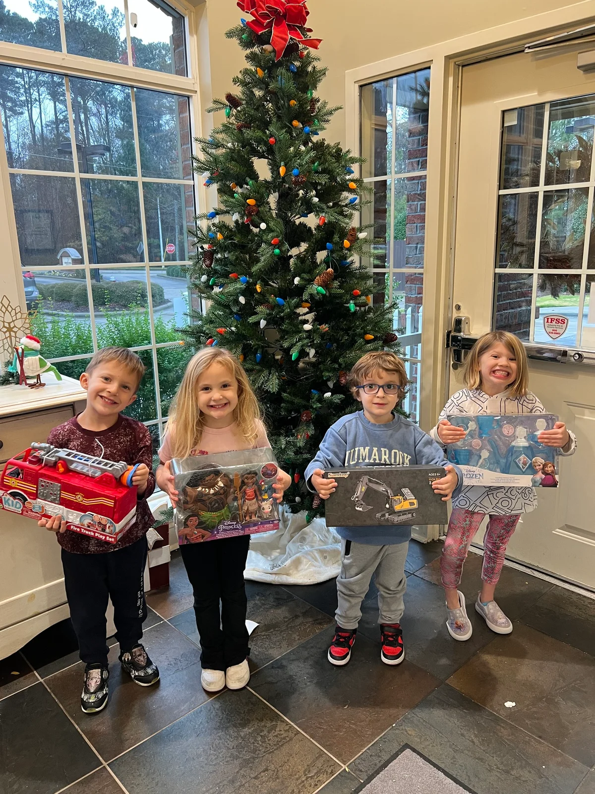 Primrose School at West Lake families supporting the Salvation Army Angel Tree Program by sponsoring six children with holiday gift boxes.
