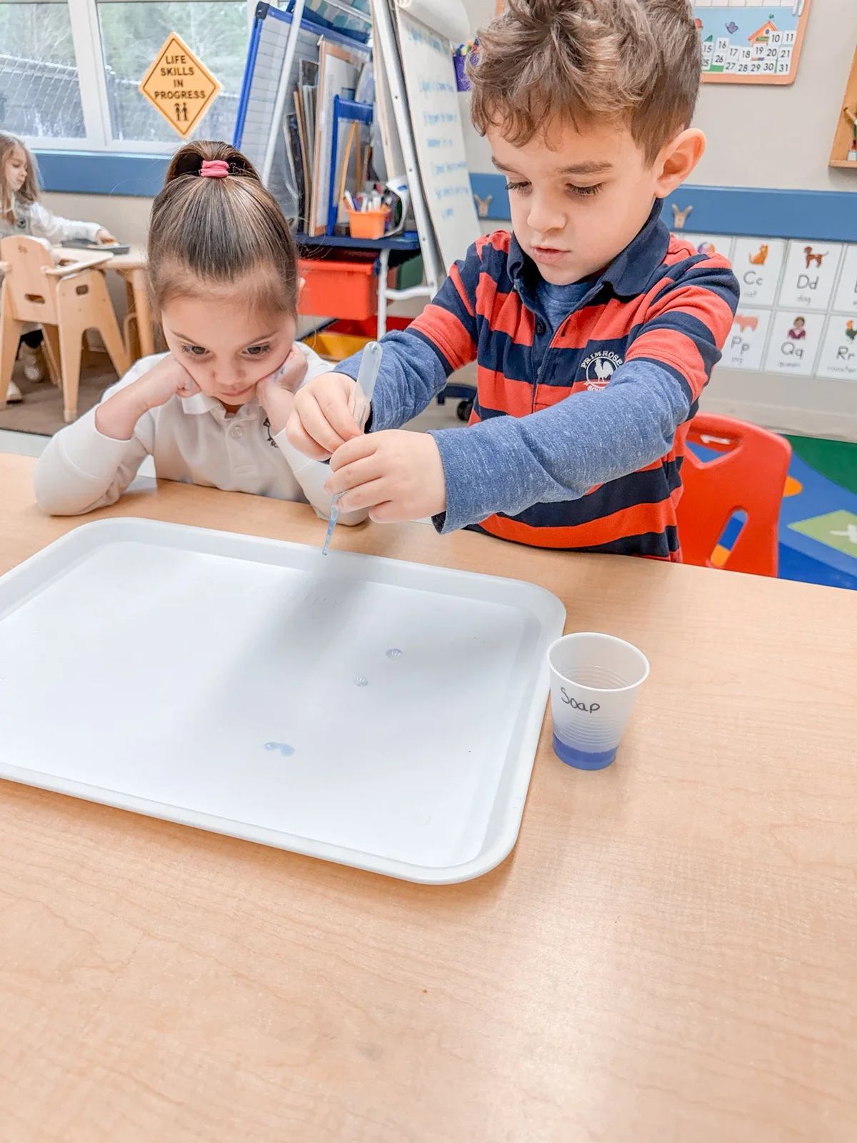Pre-K students learning about liquid