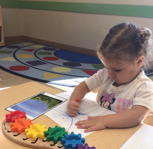 Toddler practicin handwriting skills at Fort Worth daycare