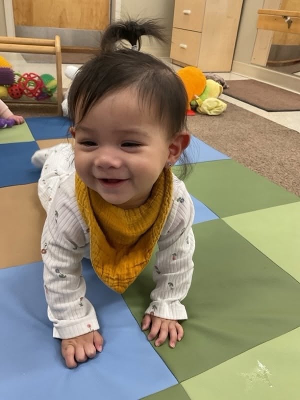 baby crawling and smiling