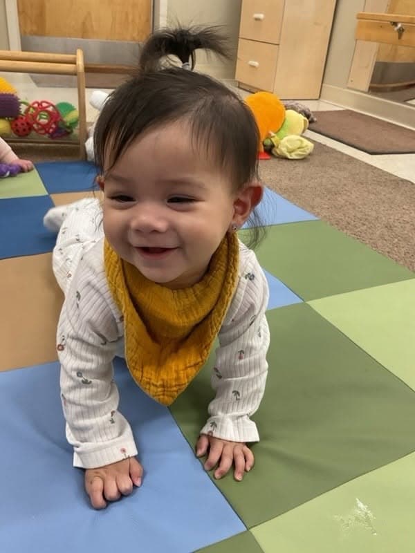 baby crawling and smiling