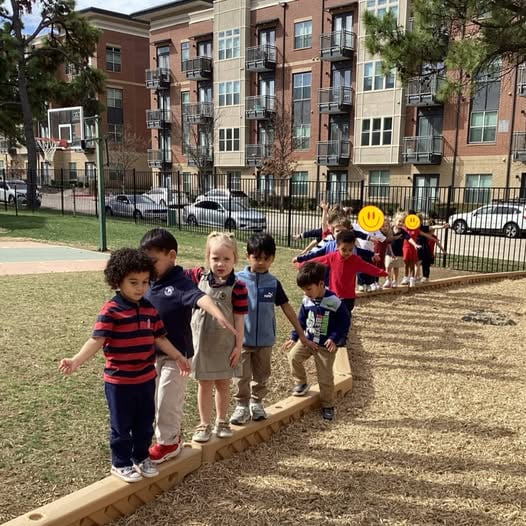 Children doing balance activities with Mia the Mouse puppet at Primrose School of NE Flower Mound