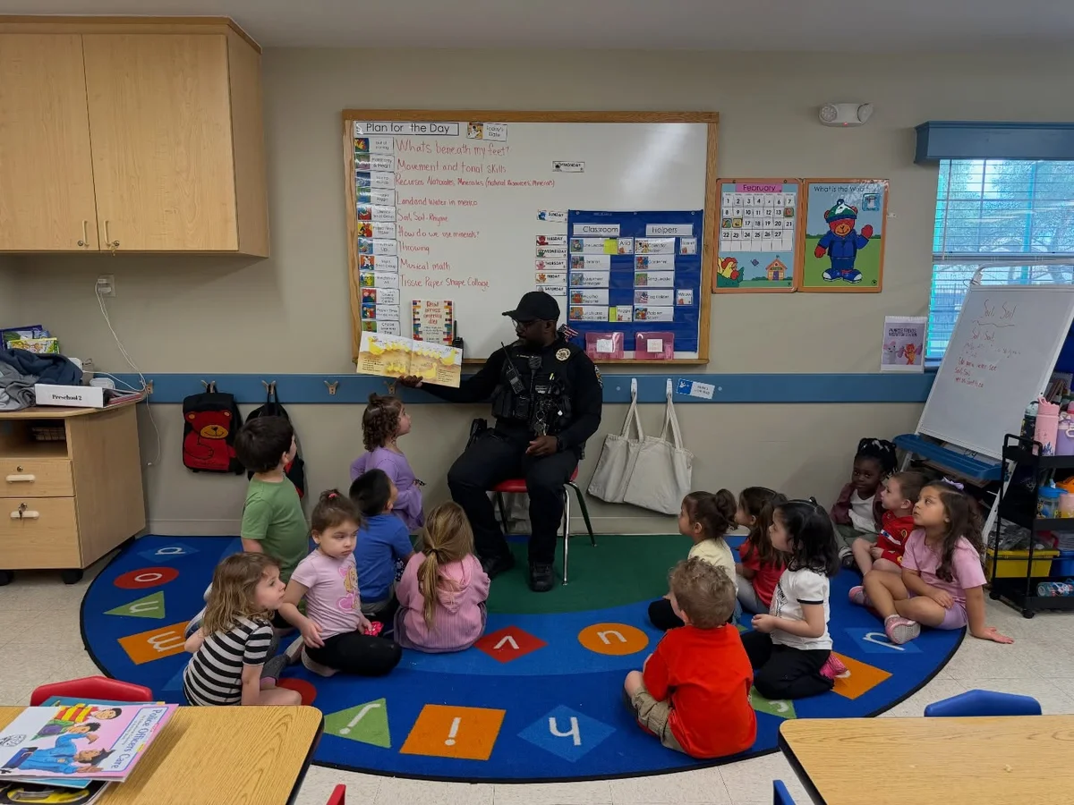 police officer reading to preschoolers during circle time