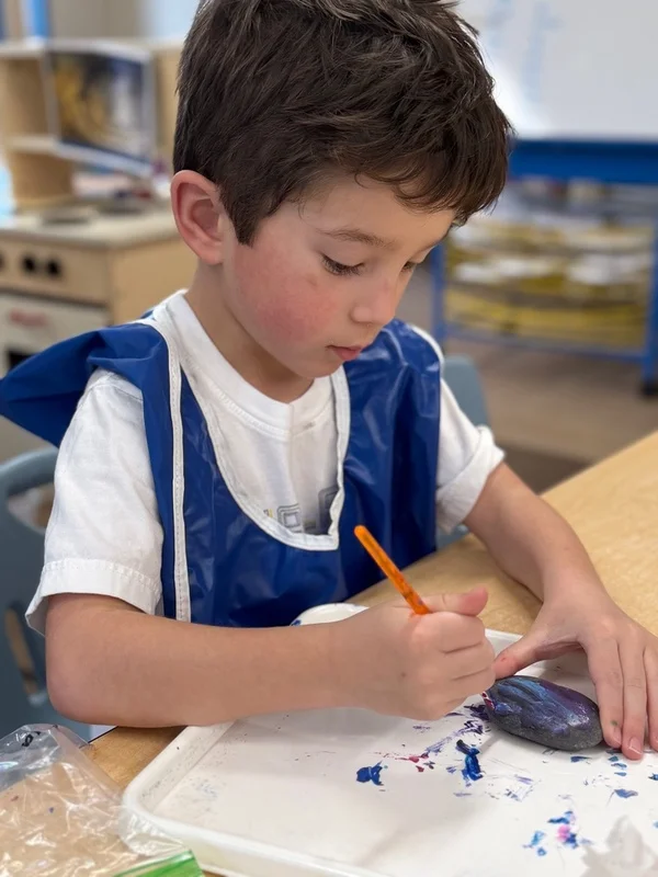 Pre-K 1 Project Time Guide the children to use rocks and paint to create artwork.