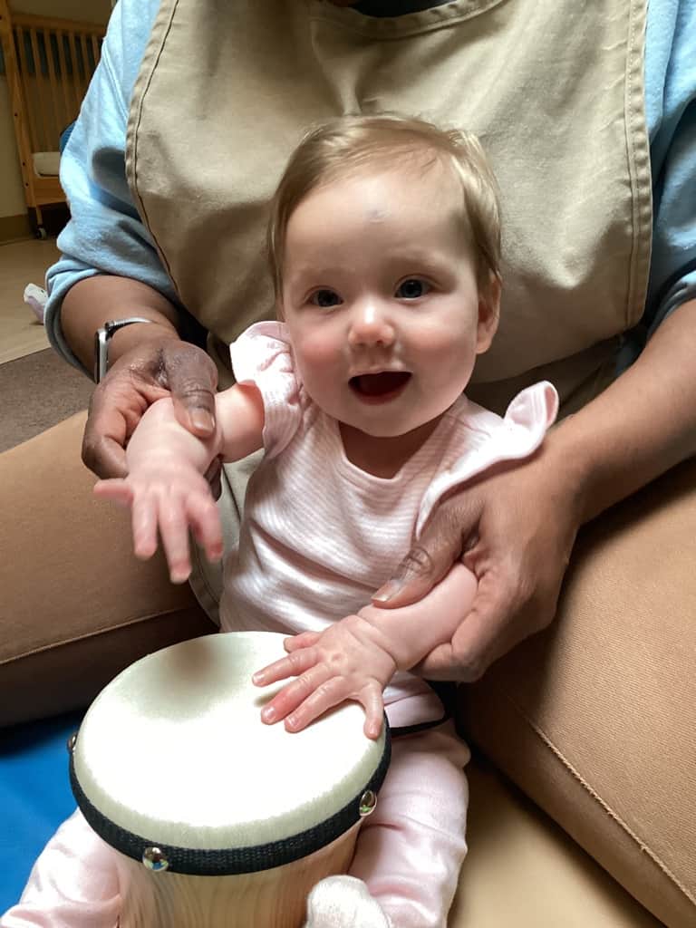 infant with drum