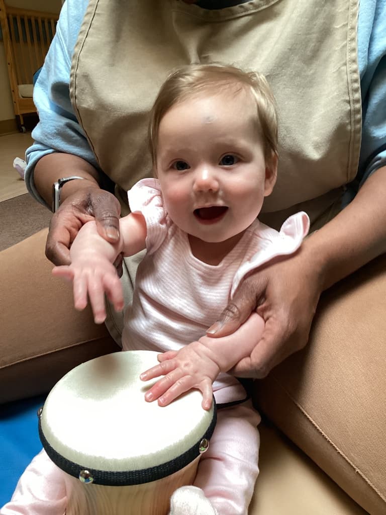 infant with drum