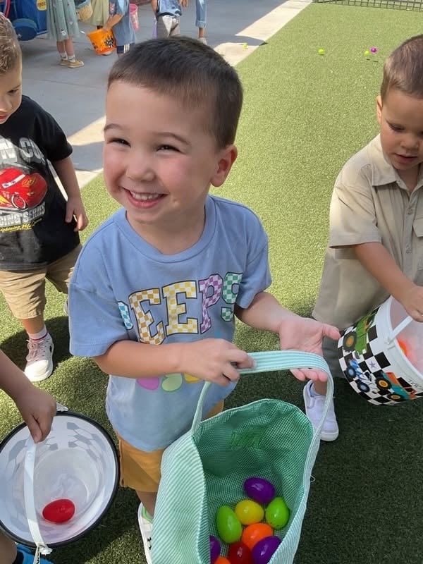 preschooler smiling ofter egg hunt