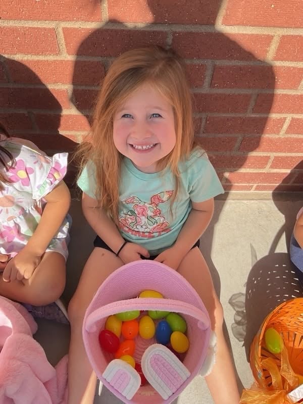 preschooler smiling after egg hunt
