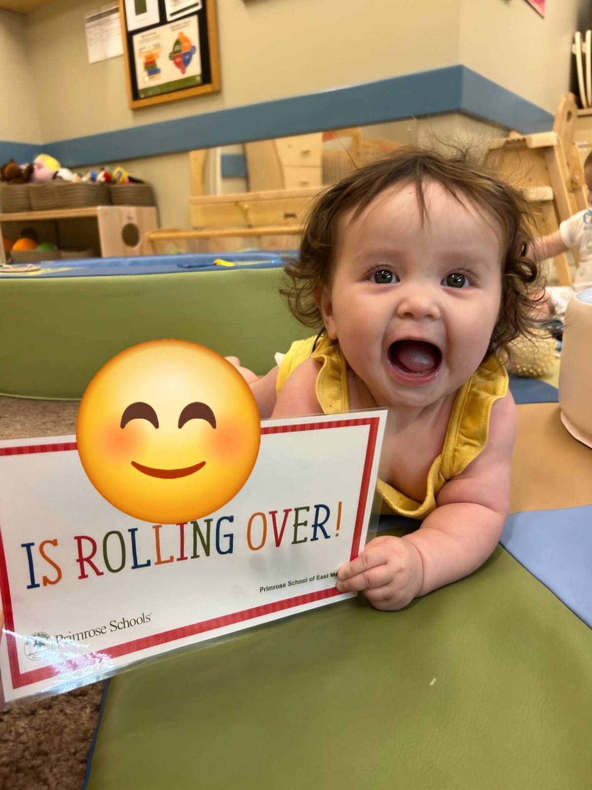 Happy infant proudly celebrating the milestone of rolling over, building strength, coordination, and confidence during early physical development at Primrose School.