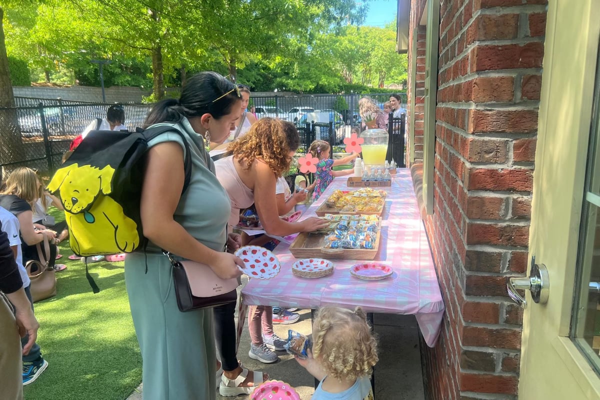 Mothers enjoying snacks and refreshments during a Mother’s Day celebration at Primrose Schools