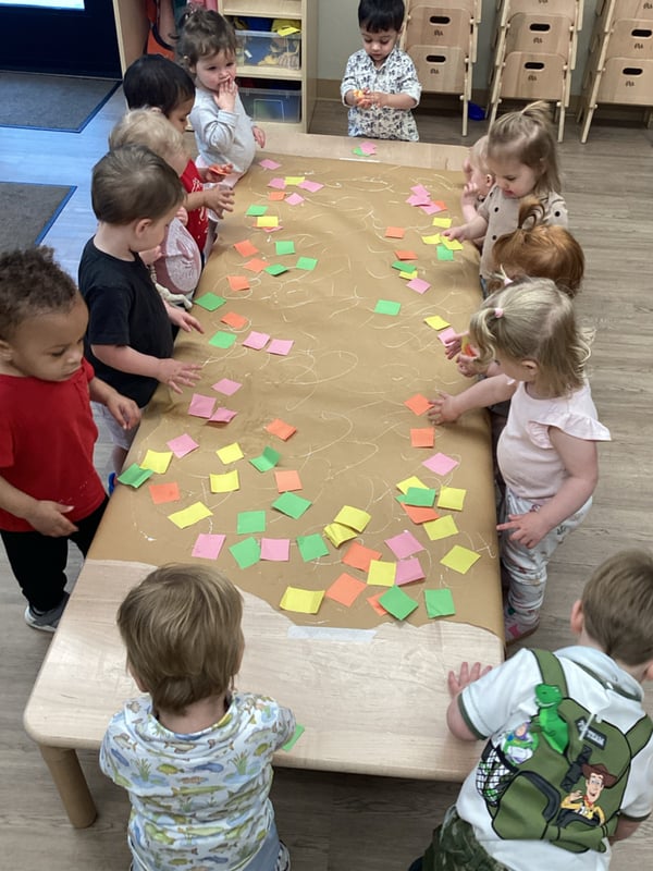 children using various shapes to make a collage