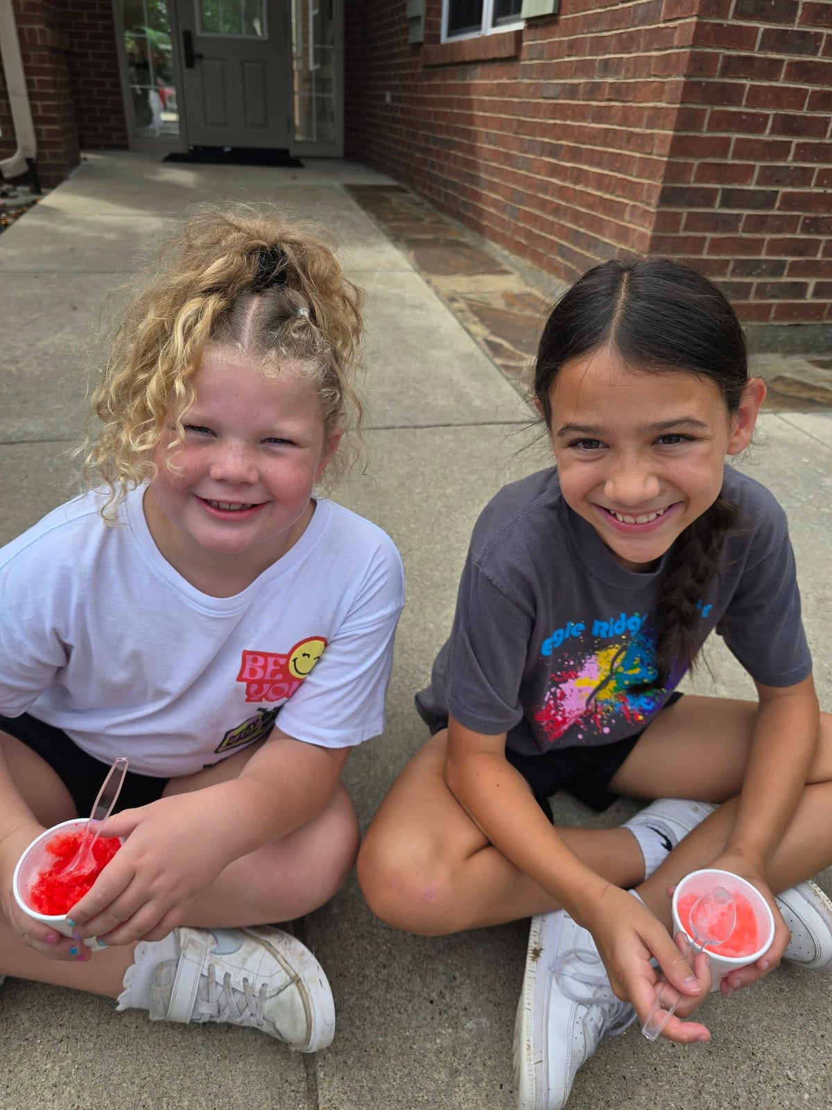 Summer Adventure Club students enjoying snow cones at Primrose School at Heritage.