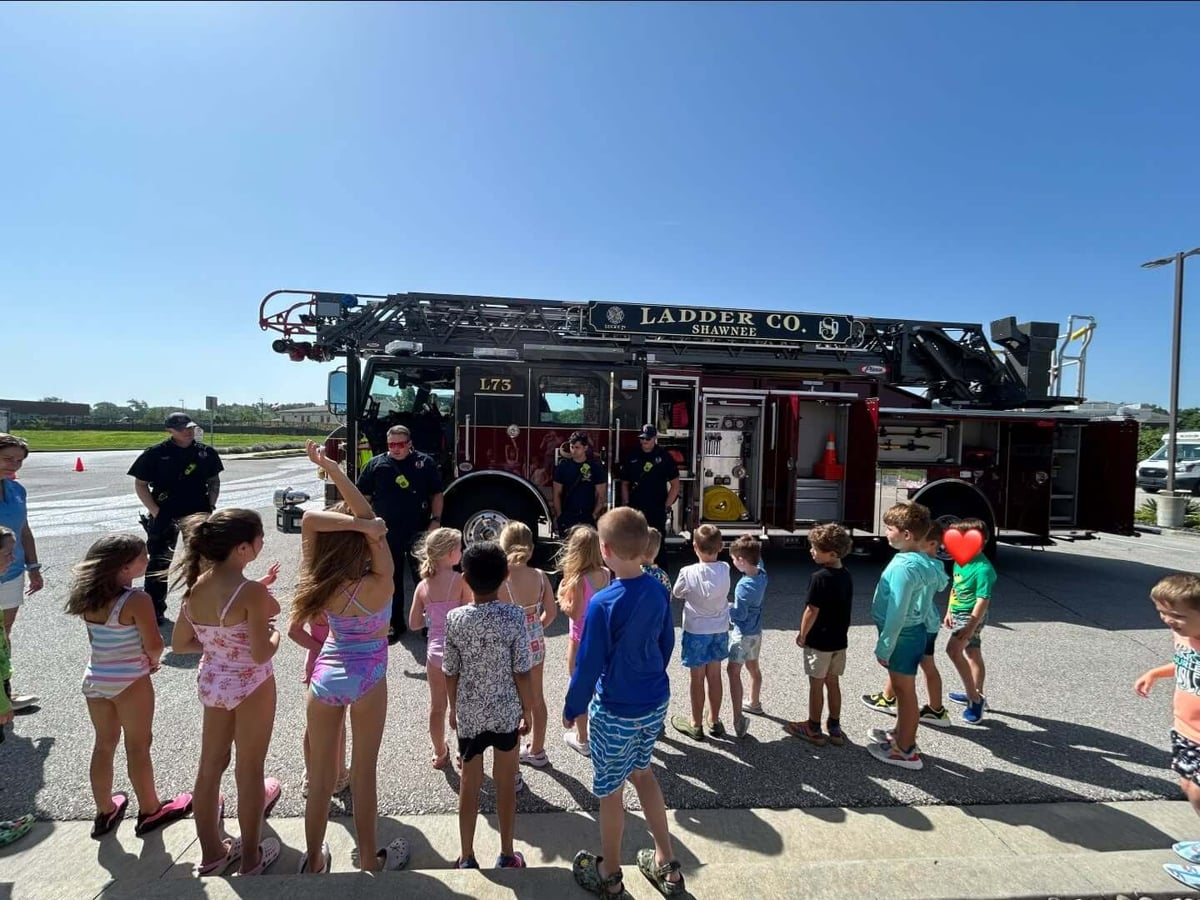 Children looking at a fire truck.
