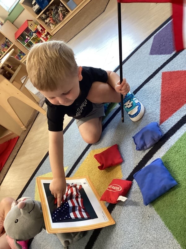 two year old care, american flag, small group