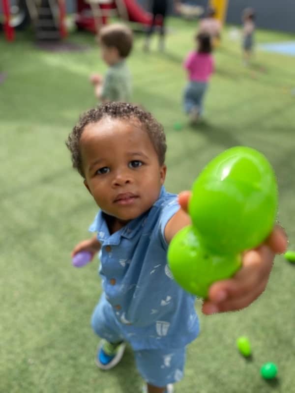 child holding easter egg