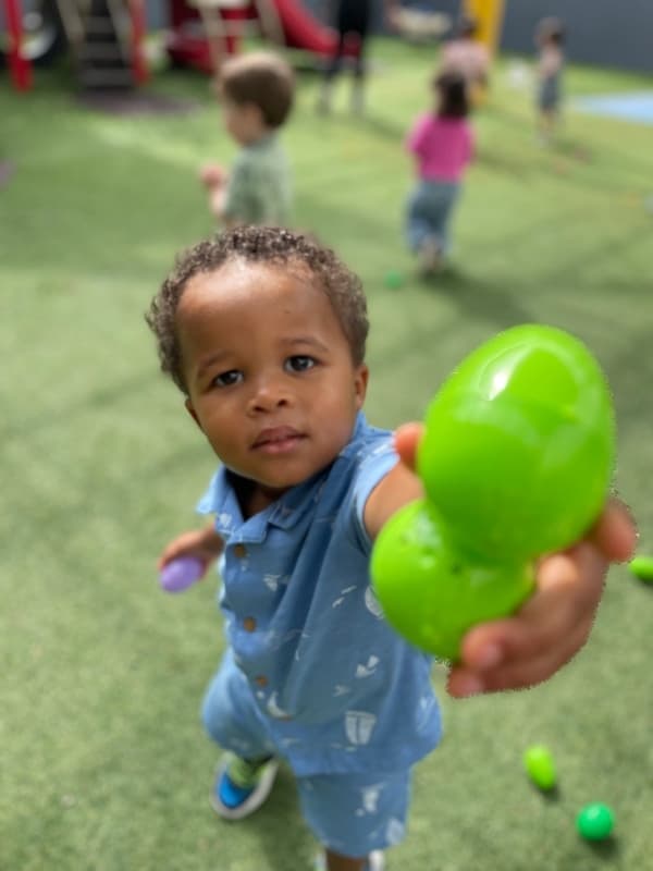 child holding easter egg