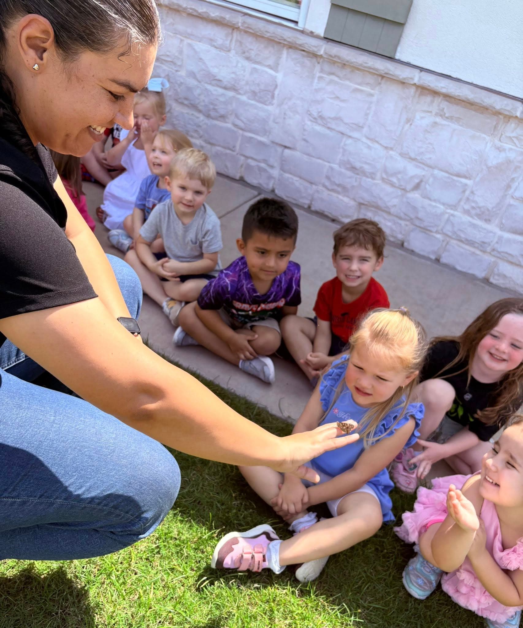 Preschool students exploring science activity at Eagle Ranch preschool