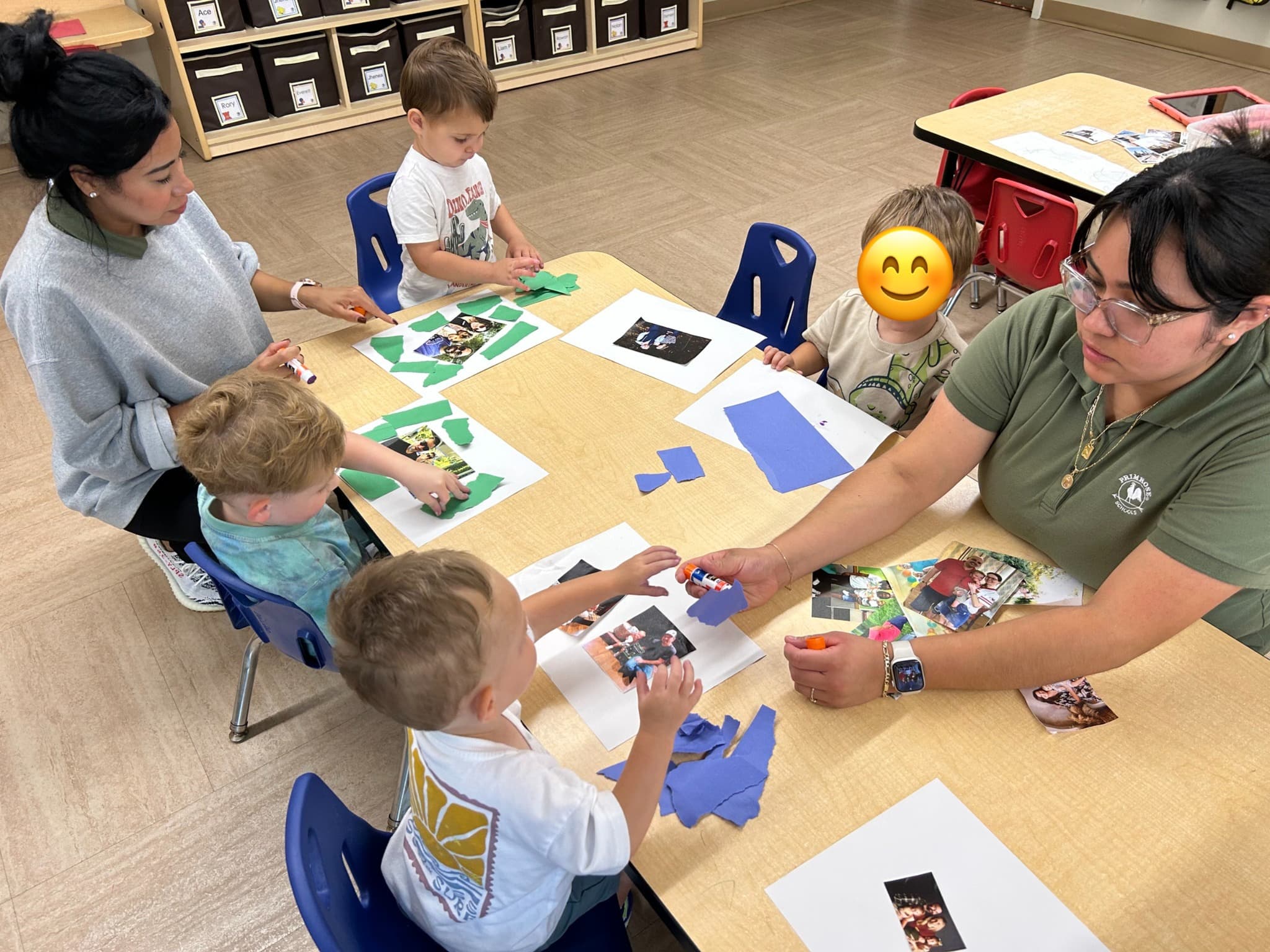 Students working on a family collage.