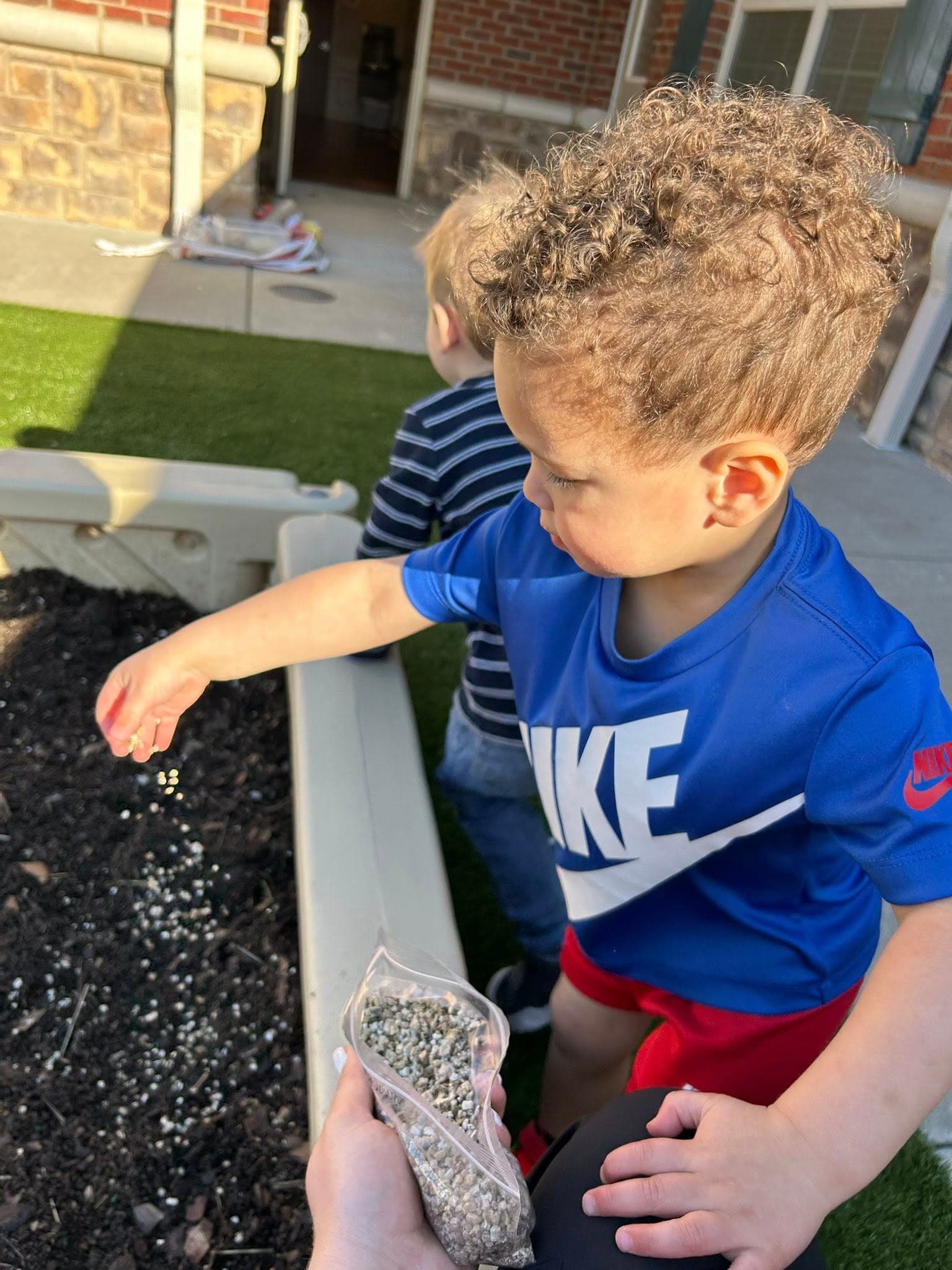 A child planting seeds in the garden