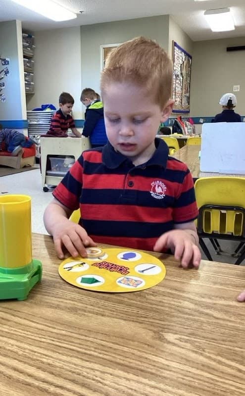 A boy participating in the teacher directed literacy lesson.