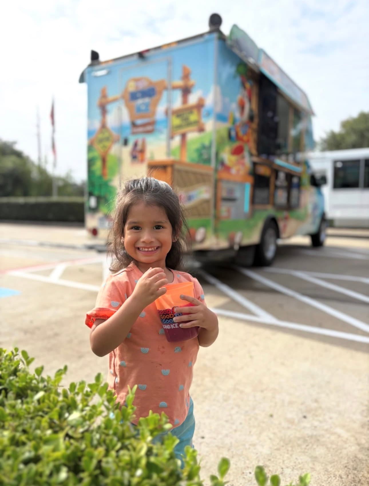 child with snow cone outside