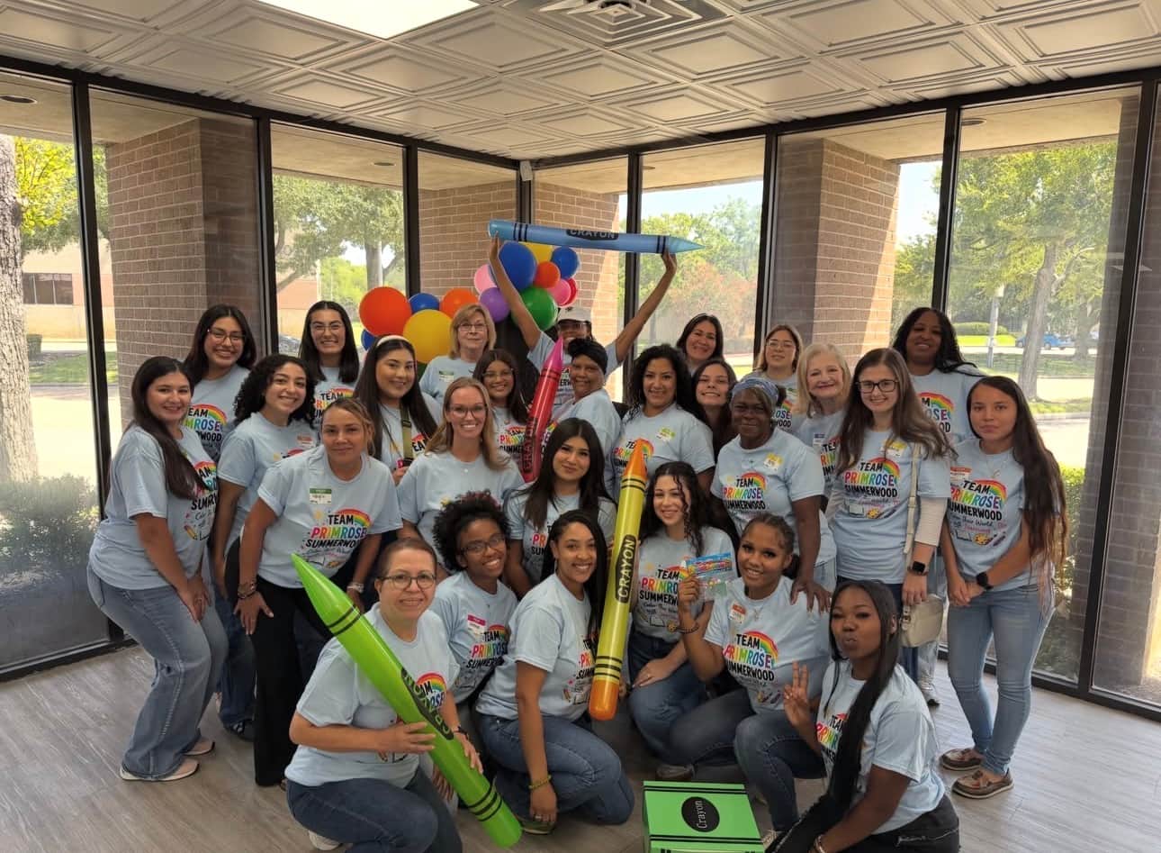 Primrose School at Summerwood staff photo with fun back to school theme