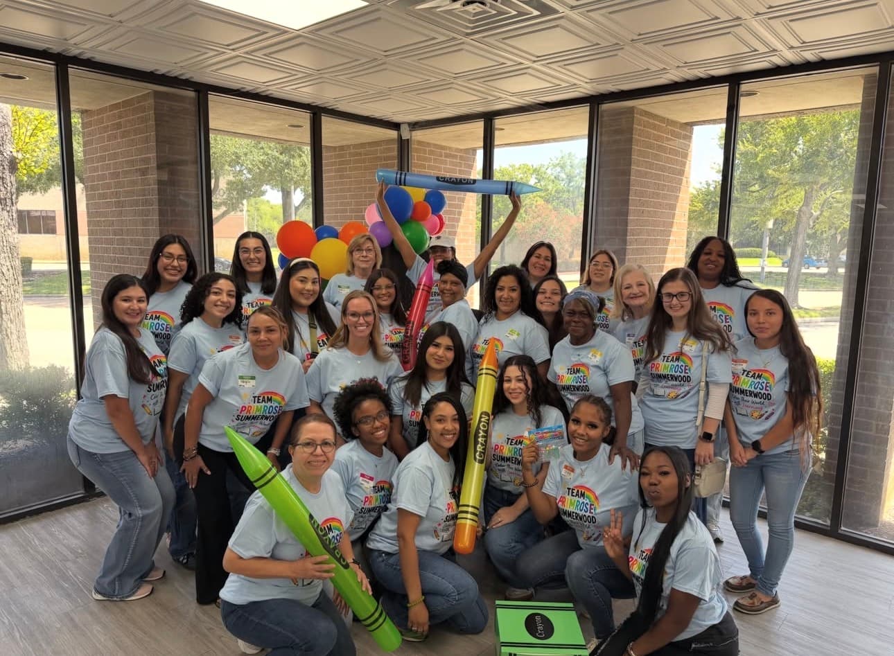 Primrose School at Summerwood staff photo with fun back to school theme