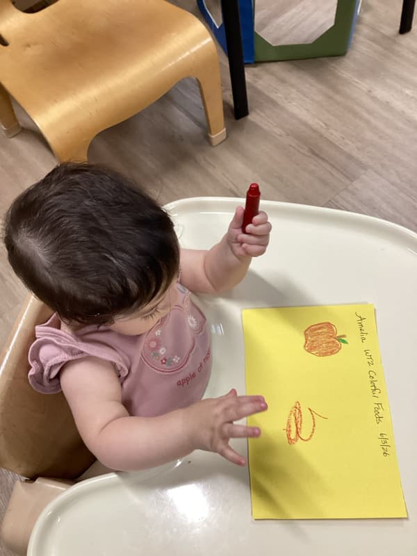Infant drawing using motor skills at Primrose School North Lewisville, Lewisville TX