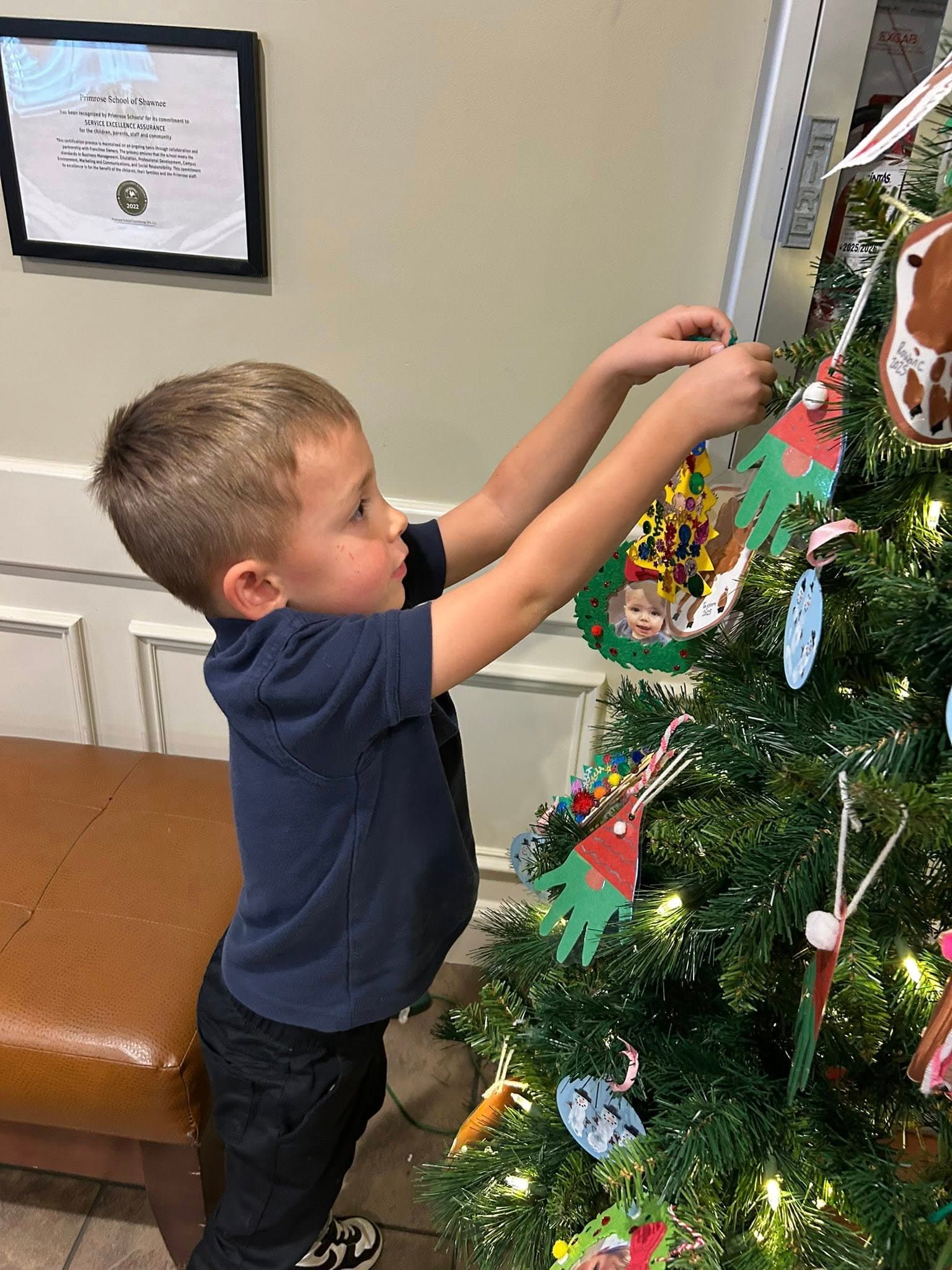 A child decorating the tree