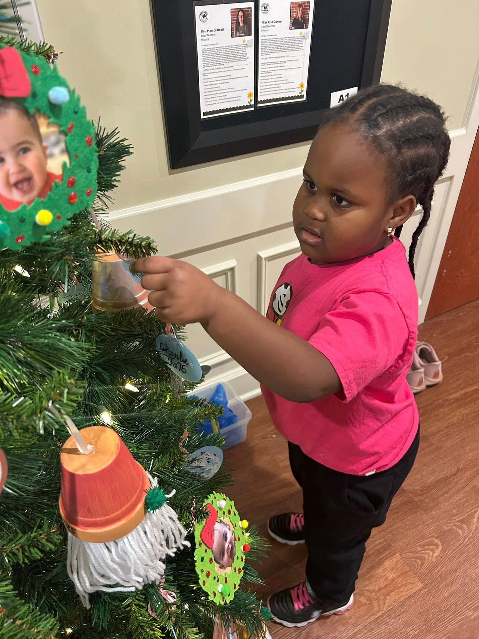 child decorating tree