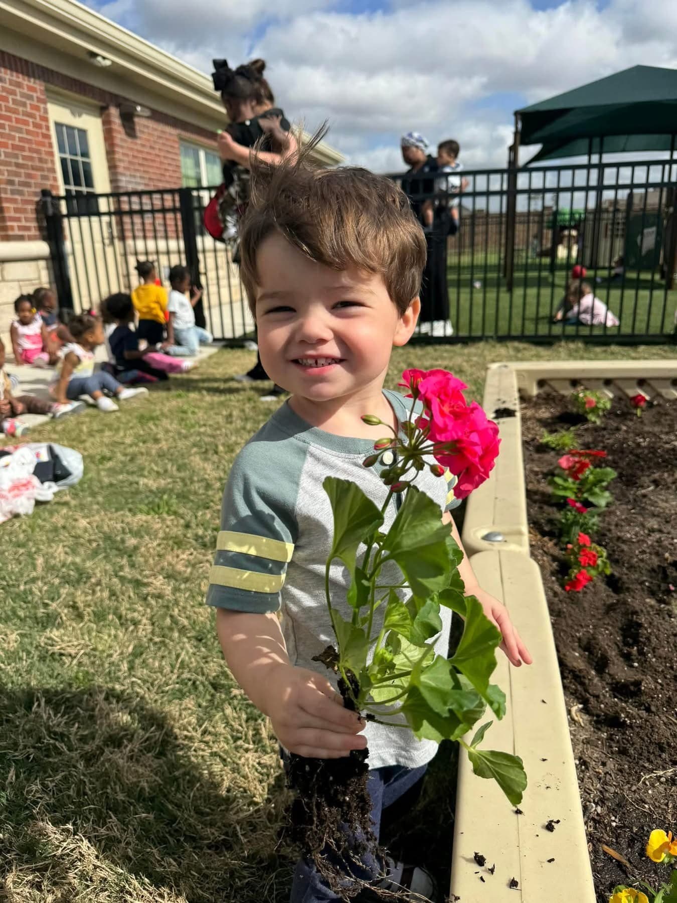 Child planting flowers