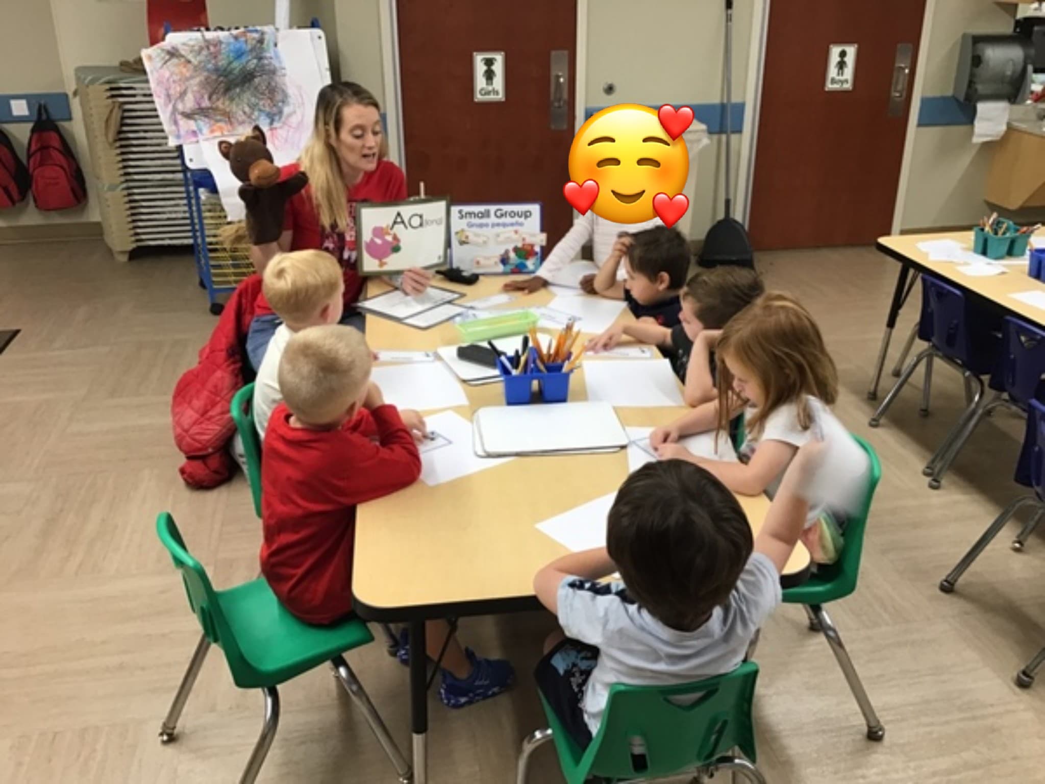 Children learning at small group.