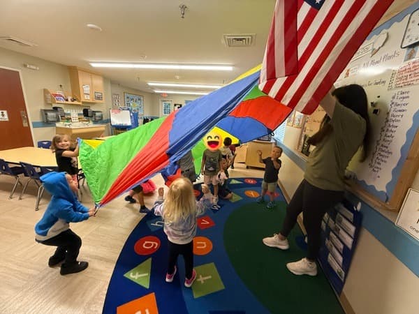 Parachute play in a classroom.