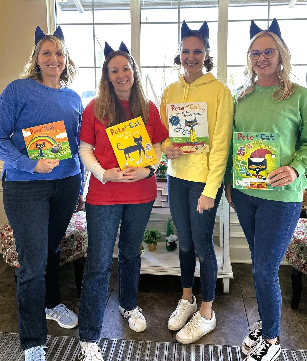 Primrose School of Eagan staff holding Pete the Cat books during the 2026 Reach Out and Read book donation drive in Eagan, MN