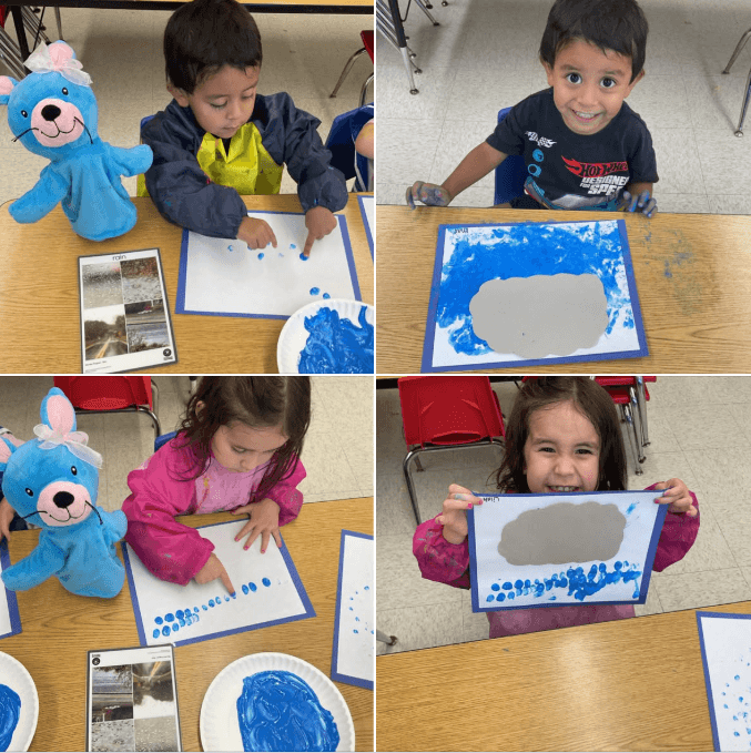 children showing their artwork