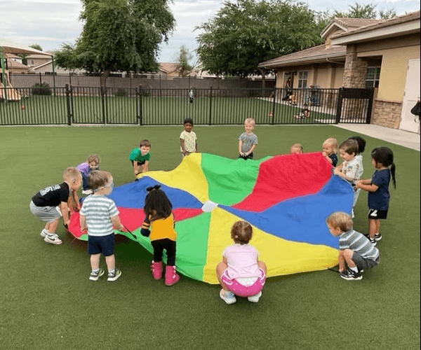 children playing with a parachute