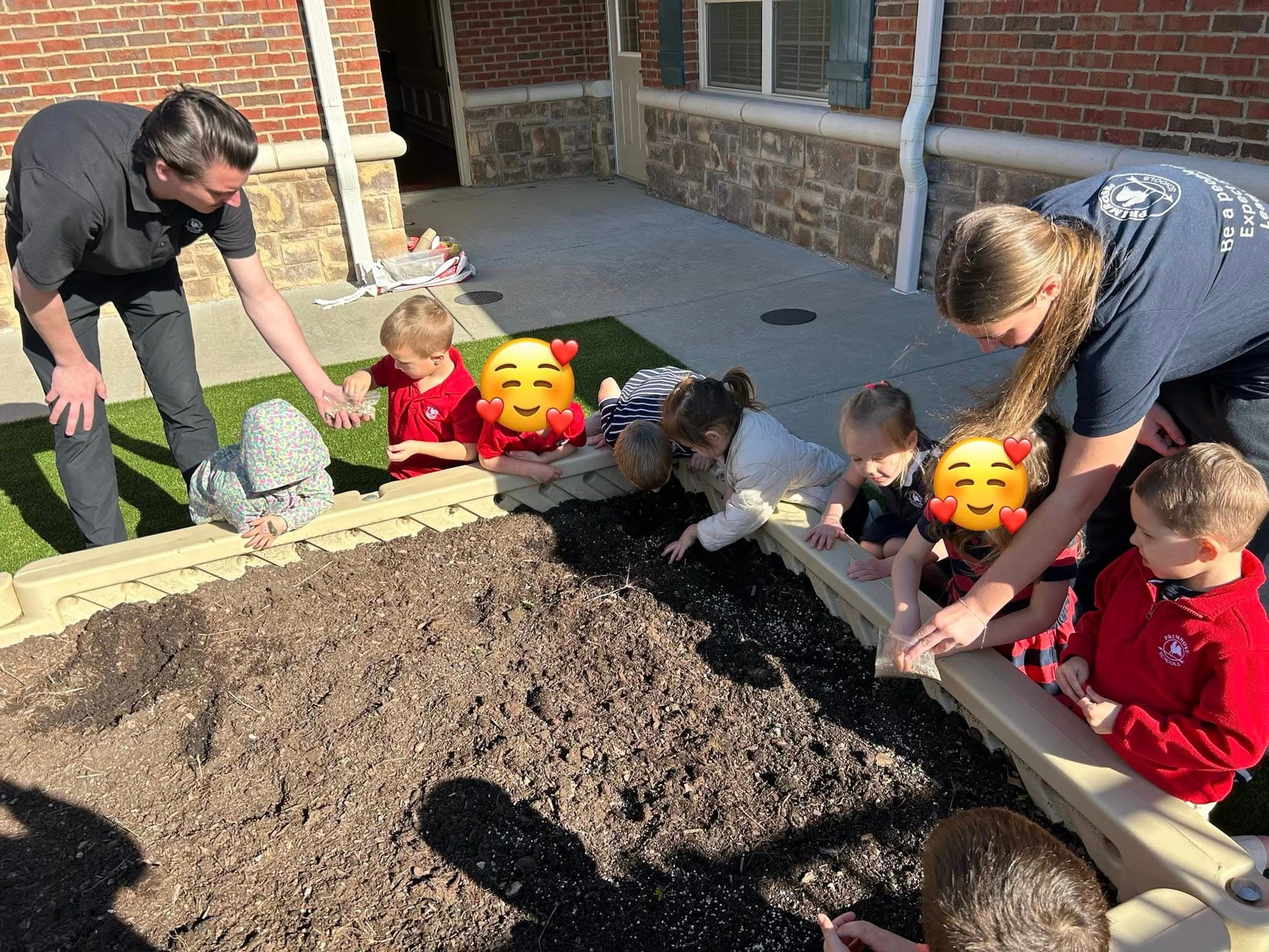 children planting seeds in a garden