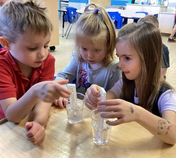 Pre- K students monitoring the temp of water