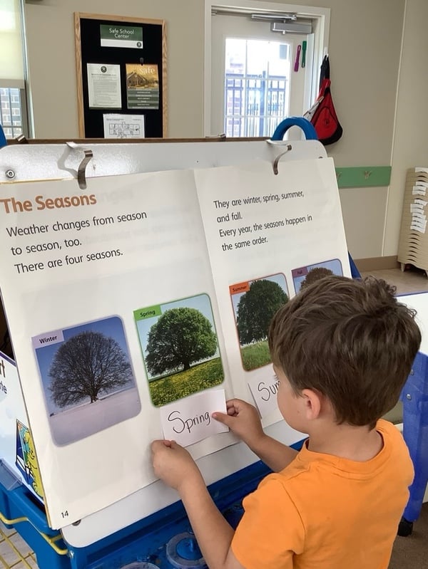 Preschool child learning about the four seasons at Primrose School.