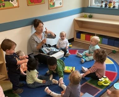 Teacher using sign language with toddlers