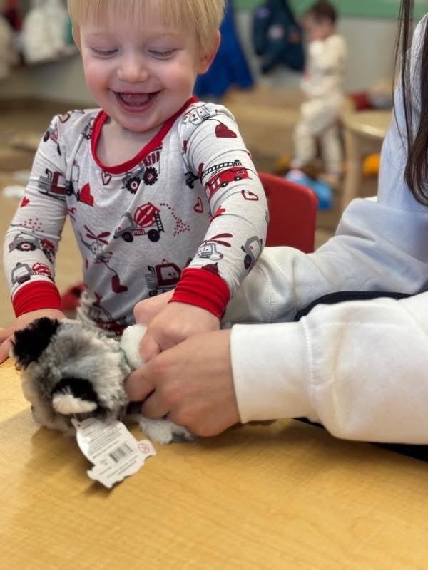 Student stuffing their build a friend stuffed animal during our fundraiser